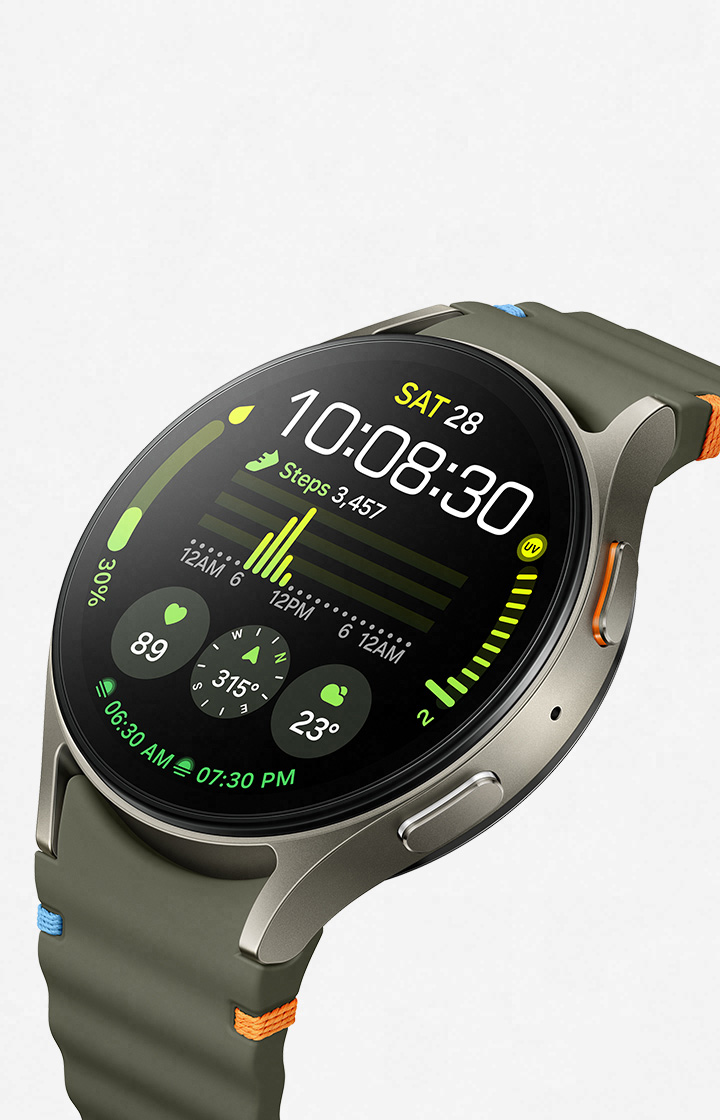 A Galaxy Watch7 with a watch face showing heart rate, steps and other workout metrics is slightly tilted facing top left. A text 'Galaxy AI is here' with a Galaxy AI icon can be seen.